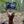 Load image into Gallery viewer, A whitetail deer hanging from a futuristic gambrel hanger that doubles as a cutting board. A trophy deer shot in the fall in Michigan.