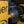 Load image into Gallery viewer, A yellow and black, cordless drill motor with a yellow and black fishing line stripping tool attached.