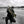 Load image into Gallery viewer, Michael Hiller ice fishing, holding a pike.