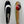 Load image into Gallery viewer, On the right there is an orange and olive bass fishing lure with a red circle that fades to black near the top with a small white HangryBrand logo near the bottom. On the left there is a shiny hex style, bass fishing spoon. that is nickel-plated.
