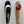 Load image into Gallery viewer, There are two fishing lures. On the right there is a bass fishing lure with an orange striped down the center and is olive on the right and left sides. Near the top of this fishing lure there is a red circle that fades to black with a small white HangryBrand logo near the bottom. On the left there is a shiny smooth style, bass fishing spoon that is nickel-plated.
