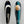 Load image into Gallery viewer, A fishing lure for Muskie. A teal and black Muskie spoon with one glittery white side, with a large orange circle near its top that fades to white
