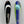 Load image into Gallery viewer, There are two fishing lures. On the right there is a bass fishing lure with a Royal blue stripe down the center and lime green on the left and right sides. This spoon has a turquoise circle near the top with a small white HangryBrand logo near the bottom. On the left there is another fishing lure. The second lure has a smooth, nickel-plated finish.
