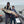 Load image into Gallery viewer, Mike Hiller (left) holding giant Musky along with Shane Hiller (right). Mike Hiller and Shane Hiller standing in a fishing boat and holding a huge Muskie caught on lake St. Clair.
